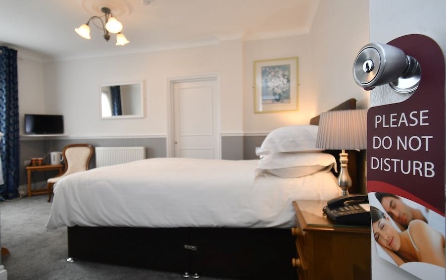 spacious hotel room with double bed in Tenby House Pembrokeshire